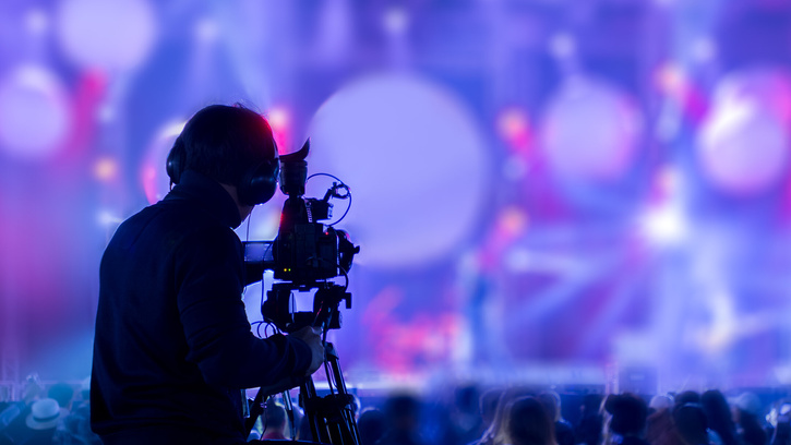 The filmmaker is recording and broadcasting live concerts on cam